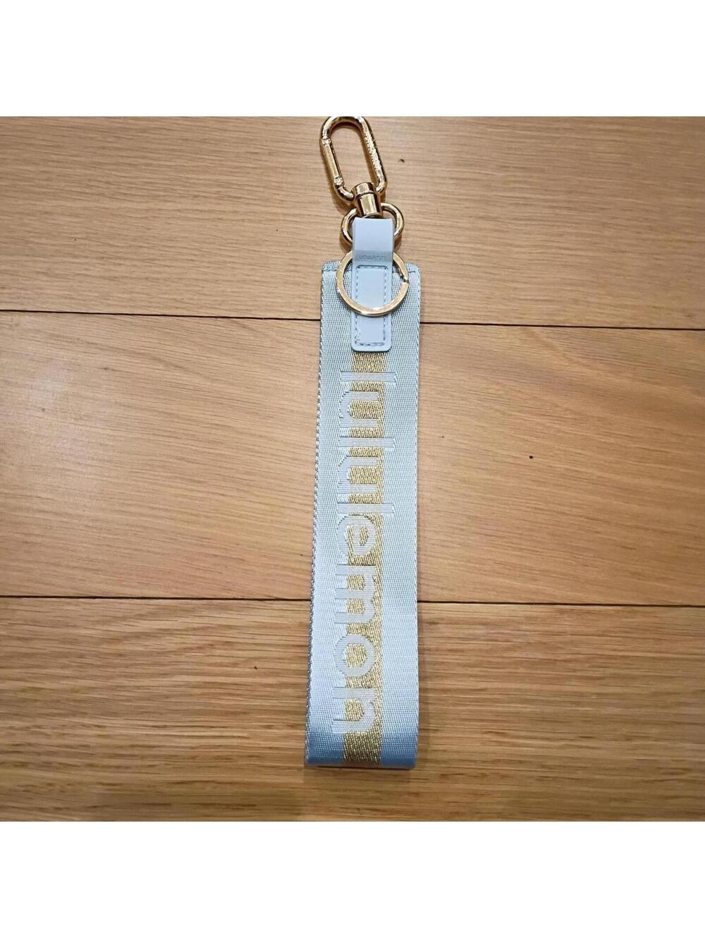 Lululemon Women's Blue and Gold never lost keychain
